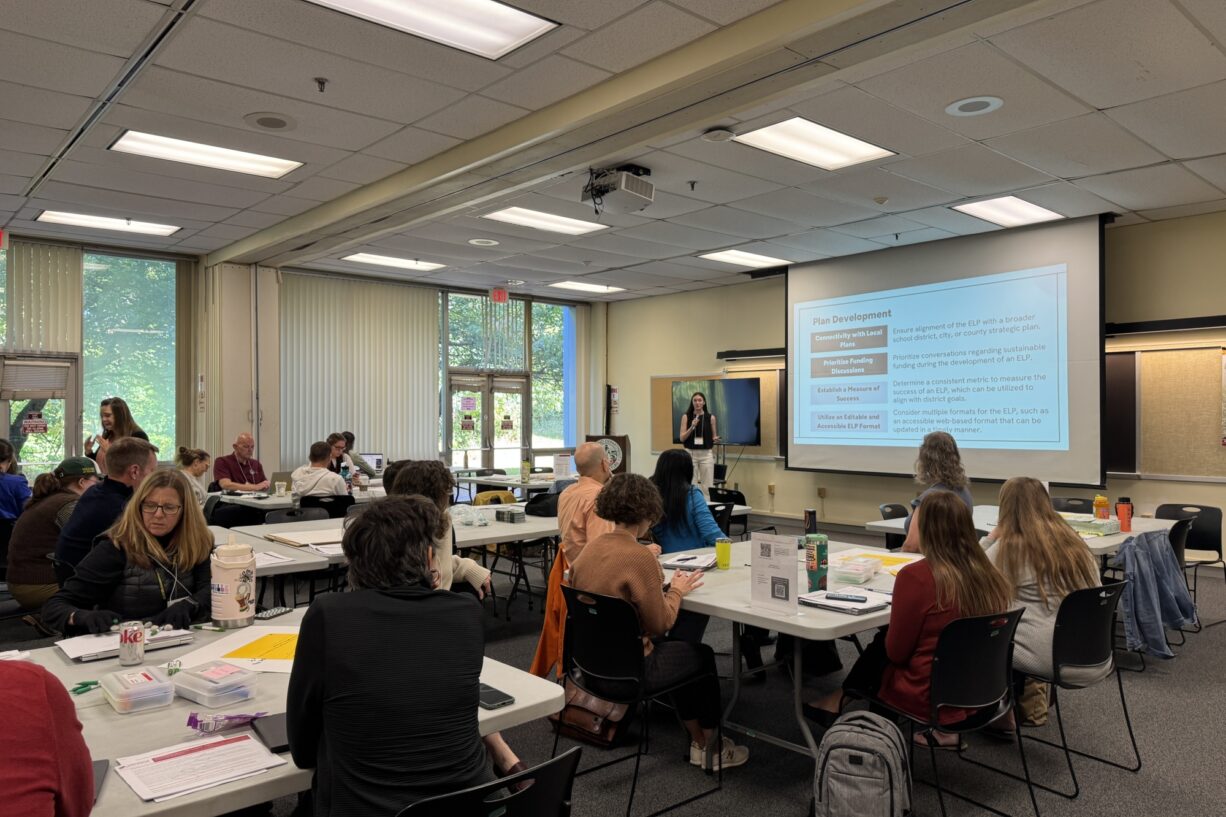 Room of educators receiving a presentation on Environmental Literacy Plans